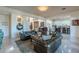 Bright living room with leather sofas and an open concept to the kitchen at 7442 E Golden Eagle Cir, Gold Canyon, AZ 85118