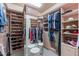 Well-organized walk-in closet with custom shelving, mirrored doors, and plenty of storage at 7442 E Golden Eagle Cir, Gold Canyon, AZ 85118