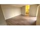 Spacious bedroom with wood-look flooring and a view to the ensuite bathroom at 9445 N 94Th Pl # 201, Scottsdale, AZ 85258