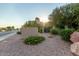 Welcoming community entrance with signage, landscaping, and a glimpse of the neighborhood beyond at 9445 N 94Th Pl # 201, Scottsdale, AZ 85258