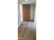 Entryway featuring wood-look flooring and a solid wood door at 9445 N 94Th Pl # 201, Scottsdale, AZ 85258