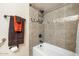 Modern tiled shower with glass door and chrome fixtures next to commode at 9501 W Hidden Valley Cir, Sun City, AZ 85351