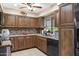 Efficient kitchen with ample storage, stainless steel appliances, and stylish backsplash at 9501 W Hidden Valley Cir, Sun City, AZ 85351