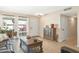 Comfortable living room with tiled floors, stylish furniture, and a large window offering natural light at 9501 W Hidden Valley Cir, Sun City, AZ 85351