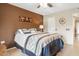 A well-decorated main bedroom featuring tile floors and a ceiling fan at 9501 W Hidden Valley Cir, Sun City, AZ 85351