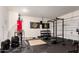 Dedicated workout area featuring weights, punching bag and equipment for a complete fitness routine at 9509 W Illini St, Tolleson, AZ 85353