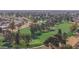 Aerial view of golf course featuring manicured greens and mature trees at 9517 W Cedar Hill Cir # N, Sun City, AZ 85351