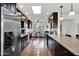 Well-lit kitchen featuring granite countertops, ample cabinetry, and modern appliances at 9517 W Cedar Hill Cir # N, Sun City, AZ 85351