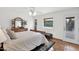 Serene main bedroom with neutral tones, soft bedding, and natural light from the windows at 9517 W Cedar Hill Cir # N, Sun City, AZ 85351