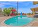 Private pool features a slide, red umbrella, desert landscaping, and plenty of space for lounging at 9517 W Cedar Hill Cir # N, Sun City, AZ 85351