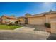 Attractive single story home with a well-manicured lawn and desert landscaping at 9617 E Holiday Way, Sun Lakes, AZ 85248