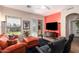 Cozy living room with a vibrant accent wall and a ceiling fan at 9617 E Holiday Way, Sun Lakes, AZ 85248