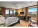 Relaxing bedroom retreat with a king bed, dresser, lounge chair and mountain views at 9962 E Groundcherry Ln, Scottsdale, AZ 85262