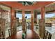 Charming dining area with a round wood table, desert views, and stylish decor at 9962 E Groundcherry Ln, Scottsdale, AZ 85262