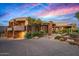 Stunning home featuring unique architecture, desert landscaping, and circular driveway at 9962 E Groundcherry Ln, Scottsdale, AZ 85262