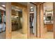 Elegant hallway leads to a walk-in closet and bathroom, showcasing the home's thoughtful design at 9962 E Groundcherry Ln, Scottsdale, AZ 85262