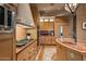 Well-lit kitchen with custom backsplash, stainless appliances, and spacious countertops at 9962 E Groundcherry Ln, Scottsdale, AZ 85262