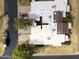 Birds eye view of neighborhood rooftops, driveways, mature landscaping and street access at 10236 E Minnesota Ave, Sun Lakes, AZ 85248