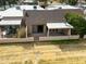Aerial view showing the private walled-in backyard with a covered patio of the home at 10236 E Minnesota Ave, Sun Lakes, AZ 85248