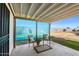 Back patio featuring a covered area, outdoor seating, and landscaping at 10324 N 97Th Dr # B, Peoria, AZ 85345