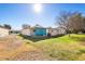 Expansive backyard with green grass, mature trees, and a covered patio at 10324 N 97Th Dr # B, Peoria, AZ 85345