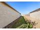 Backyard exterior highlighting a walkway between the home and a detached structure at 10324 N 97Th Dr # B, Peoria, AZ 85345