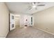 Serene bedroom with ceiling fan and an ensuite bathroom at 10324 N 97Th Dr # B, Peoria, AZ 85345