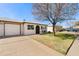 Charming single-story home features a neat front yard, driveway, and a single-car garage at 10324 N 97Th Dr # B, Peoria, AZ 85345