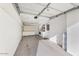 Spacious garage with ample storage cabinets and a laundry area at 10324 N 97Th Dr # B, Peoria, AZ 85345