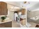 Well-maintained kitchen featuring white appliances and wood cabinetry with backyard views at 10324 N 97Th Dr # B, Peoria, AZ 85345