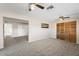 Open living space with view to bedroom, neutral paint, and plush carpet at 10324 N 97Th Dr # B, Peoria, AZ 85345