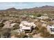 Desert home with a backyard pool and views of golf course and mountains at 10687 E Fernwood Ln, Scottsdale, AZ 85262