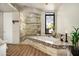 Elegant bathroom featuring a soaking tub, glass-enclosed shower, and luxurious finishes at 10687 E Fernwood Ln, Scottsdale, AZ 85262