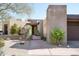 Desert home with gated entry, yucca, and xeriscape front yard at 10687 E Fernwood Ln, Scottsdale, AZ 85262