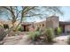 Desert home with gated entry, yucca, and native landscaping at 10687 E Fernwood Ln, Scottsdale, AZ 85262