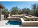 Backyard featuring a small plunge pool surrounded by unique desert landscaping at 10687 E Fernwood Ln, Scottsdale, AZ 85262