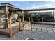 Landscaped backyard featuring a gazebo, water feature, decorative plants, and seating area at 11215 N 37Th Ave, Phoenix, AZ 85029