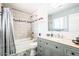 Charming bathroom featuring a tub, shower, vanity, and light gray color scheme at 11215 N 37Th Ave, Phoenix, AZ 85029