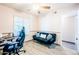 Comfortable bedroom featuring a futon, desk, and a ceiling fan at 11215 N 37Th Ave, Phoenix, AZ 85029