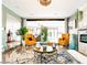 Comfortable living room with modern fireplace, stylish decor, with bright orange chairs at 11215 N 37Th Ave, Phoenix, AZ 85029