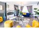 Comfortable living room with modern fireplace, stylish decor, and a blue couch near a sunny window at 11215 N 37Th Ave, Phoenix, AZ 85029