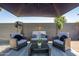 Cozy outdoor seating area with stylish wicker furniture and a large umbrella at 11215 N 37Th Ave, Phoenix, AZ 85029