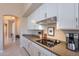 Kitchen counter with white cabinets and granite countertops at 11947 E Terra Dr, Scottsdale, AZ 85259