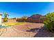 Expansive backyard features low-maintenance desert landscaping and ample space at 13615 W Merrell St, Avondale, AZ 85392