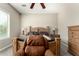 Bedroom with comfortable furniture, soft carpet, neutral walls, and natural light at 13615 W Merrell St, Avondale, AZ 85392