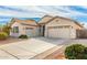 Beautiful single-Gathering home featuring a three-car garage and well-maintained desert landscaping at 13615 W Merrell St, Avondale, AZ 85392