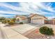 Well-maintained home boasts a three-car garage, mature landscaping, and an extended driveway at 13615 W Merrell St, Avondale, AZ 85392