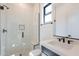 Modern bathroom with sleek shower, glass enclosure, and elegant fixtures, showcasing contemporary design at 14445 N Valencia Dr, Fountain Hills, AZ 85268