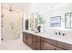 Modern bathroom featuring double sinks, a large shower, and sleek design elements for a spa-like experience at 14445 N Valencia Dr, Fountain Hills, AZ 85268