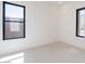 Bright, unfurnished room featuring tiled floor, large windows, and neutral colors, ready for personalization at 14445 N Valencia Dr, Fountain Hills, AZ 85268